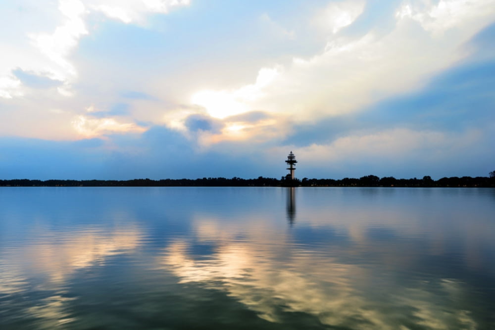 The tranquil lake reflecting the cloudy sky. Lake Conroe, Texas